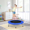 Mini folding trampoline in blue with protective cover and sturdy steel legs, ideal for portable fitness fun indoors.