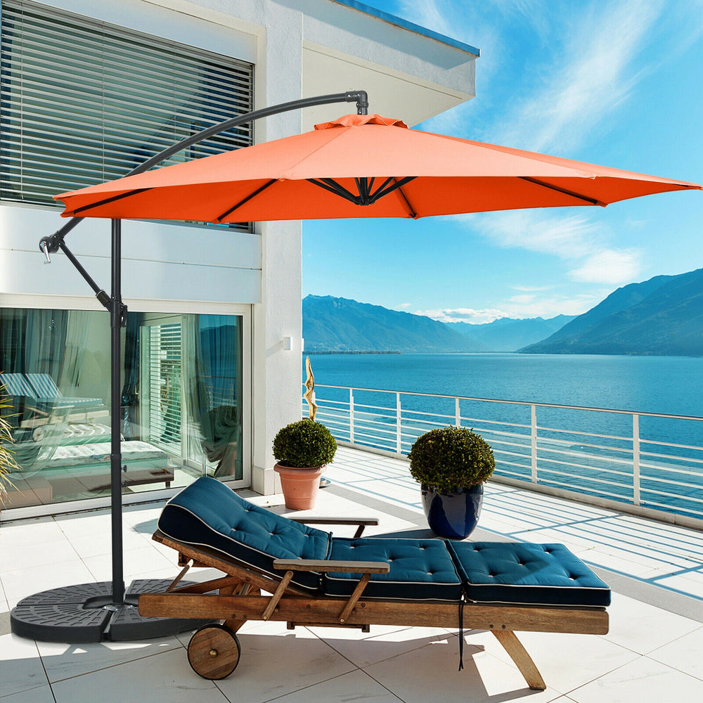 10 feet orange offset umbrella with 8 ribs, featuring a cantilever design for adjustable shade on a patio.