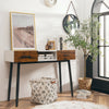 42-inch industrial console table with two drawers, styled with decorative items in a cozy entryway setting.