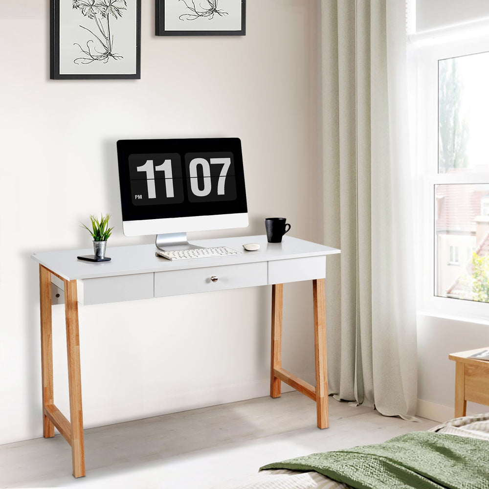 White computer desk with rubberwood legs and a large drawer, perfect for home office or as a makeup vanity.