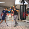 Kids boxing set featuring a punch bag, gloves, and skipping rope, ideal for children's workouts and fitness training.