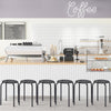 Set of 6 black backless round metal stools with daisy design, ideal for indoor and outdoor use, stackable for storage.
