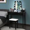 Black vanity table set with lighted mirror, featuring 10 dimmable bulbs and ample storage for cosmetics in a stylish.