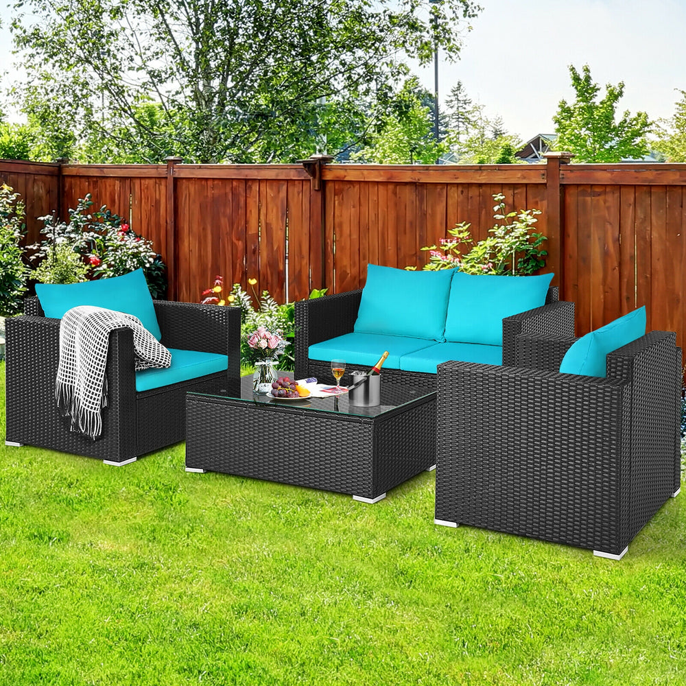 Four-piece patio rattan furniture set with turquoise cushions, featuring a coffee table and durable PE rattan for.