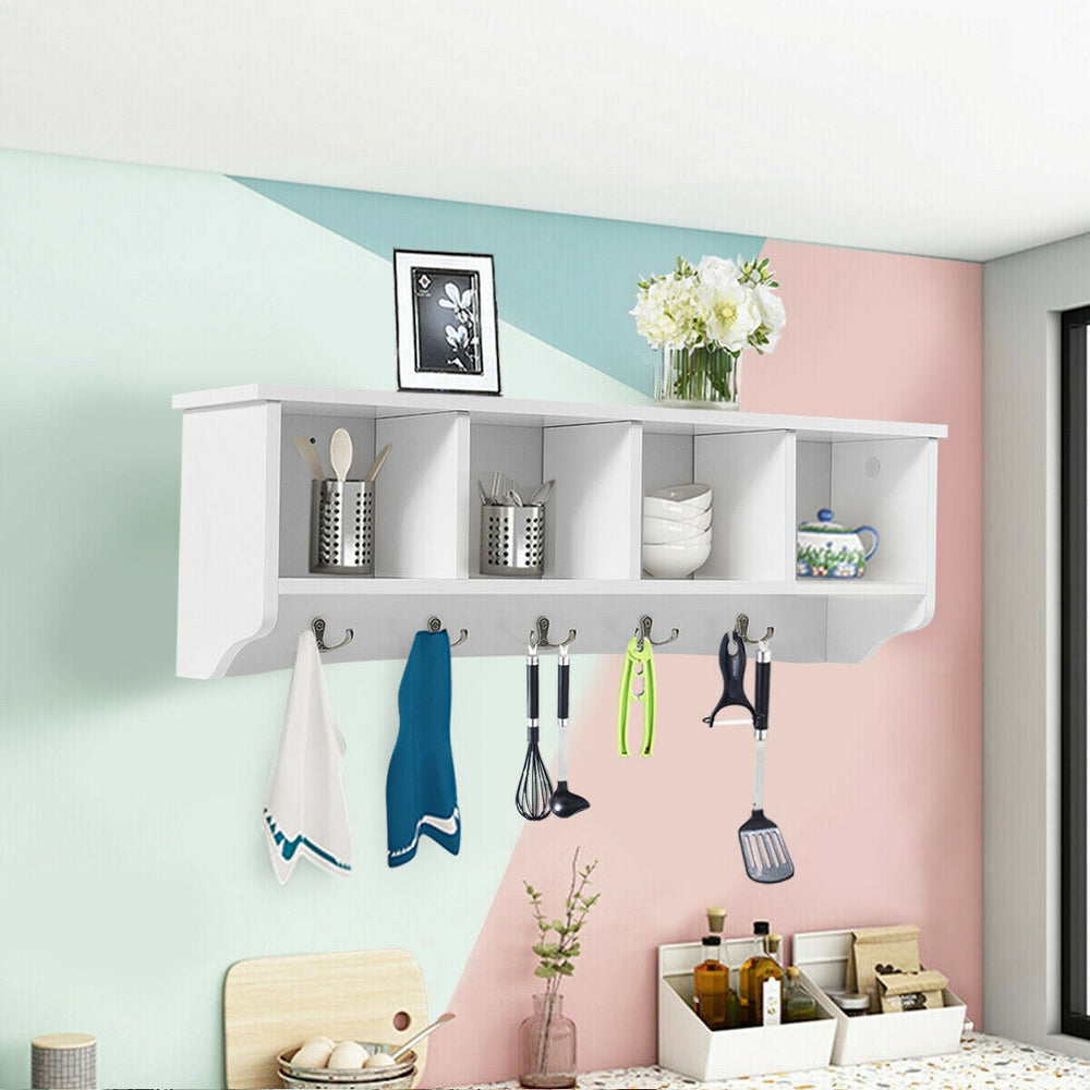 Wall-mounted shelf with four compartments and five hooks for stylish storage in living room or kitchen, made of hard.