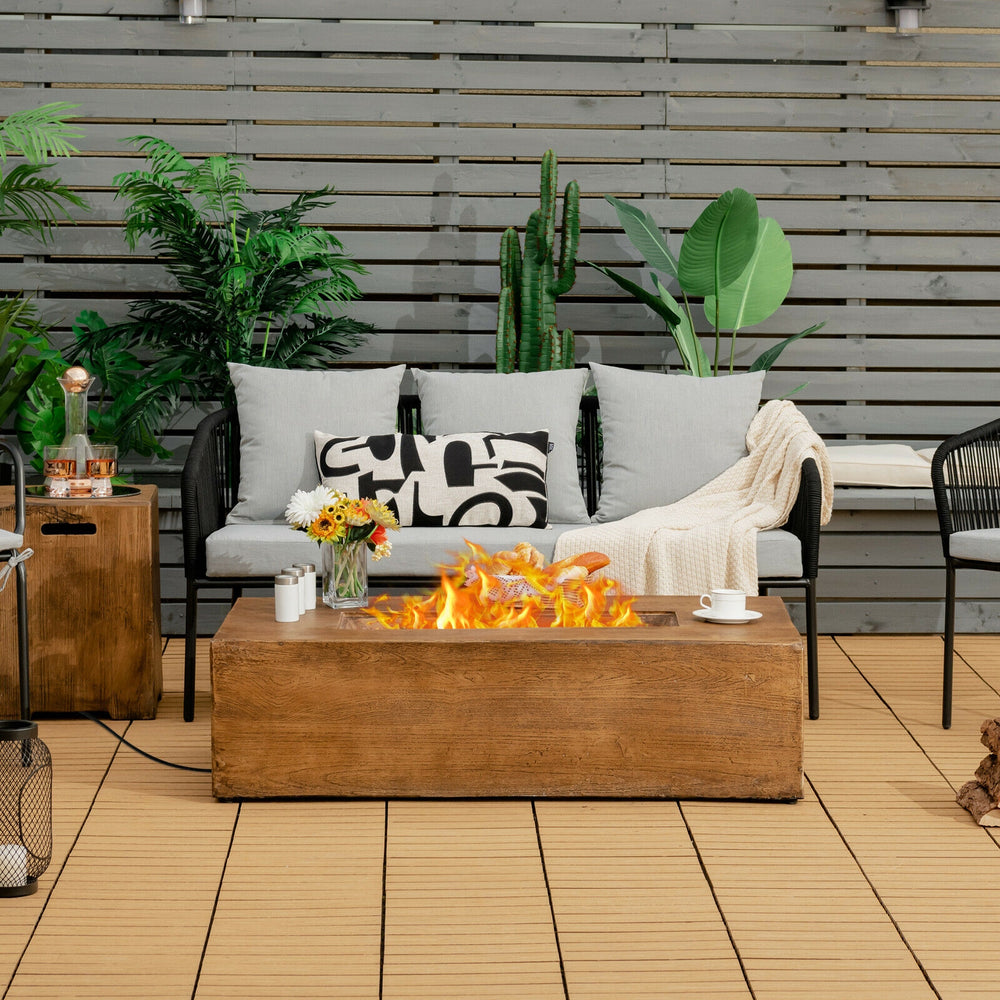 Rectangular 48" outdoor gas fire pit table with lava rocks, 50,000 BTU, and rustic wood grain design for patio warmth.