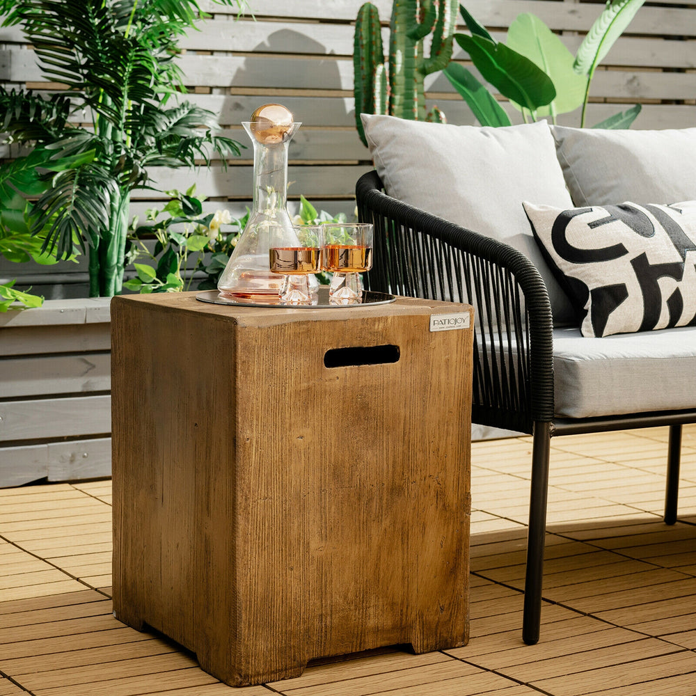Outdoor hideaway table with rustic wood grain, side handles, and adjustable foot pads for propane tank storage and side.