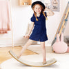 Child balancing on a 12-inch natural birch wobble board, promoting fun and coordination for indoor play.