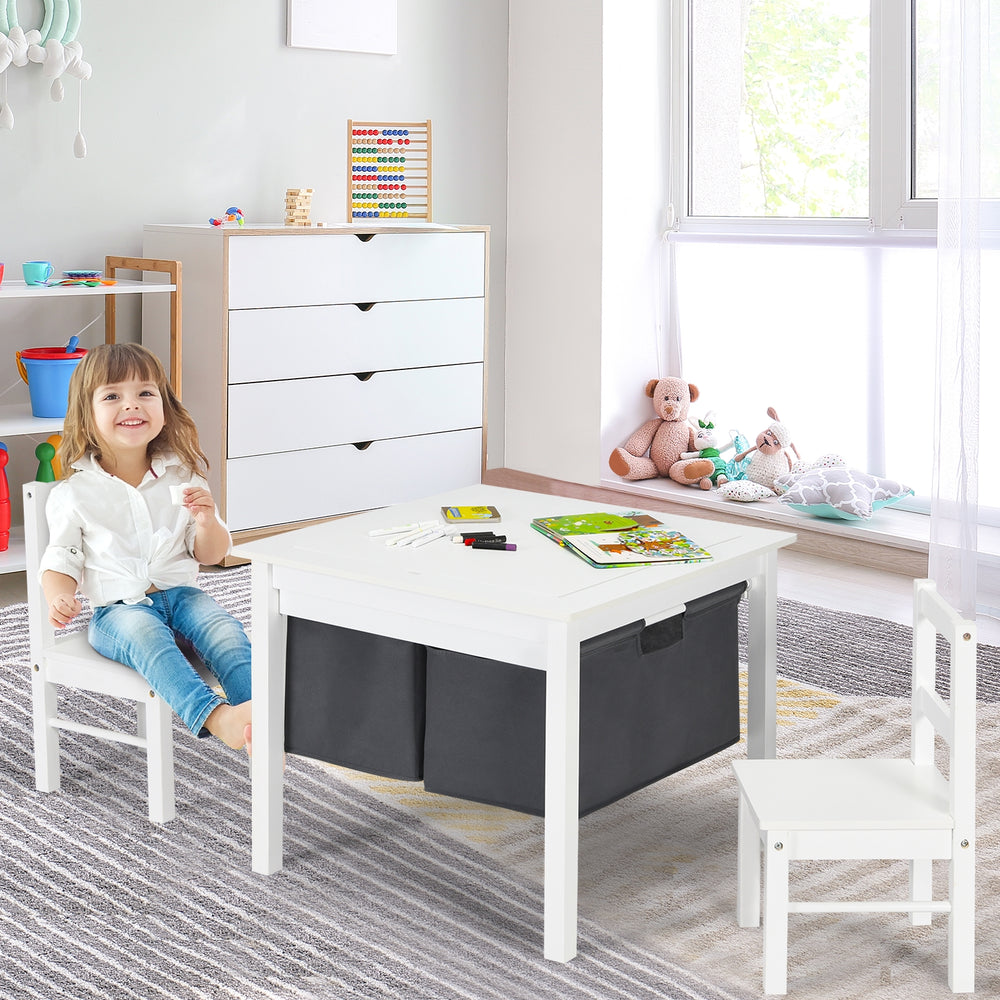 Kids activity table set with two chairs, featuring storage drawers and a double-sided panel for building and drawing.