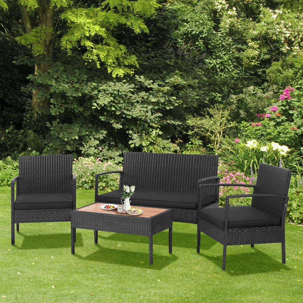 4-piece patio rattan furniture set with cushioned loveseat and chairs, featuring a premium acacia wood tabletop for.