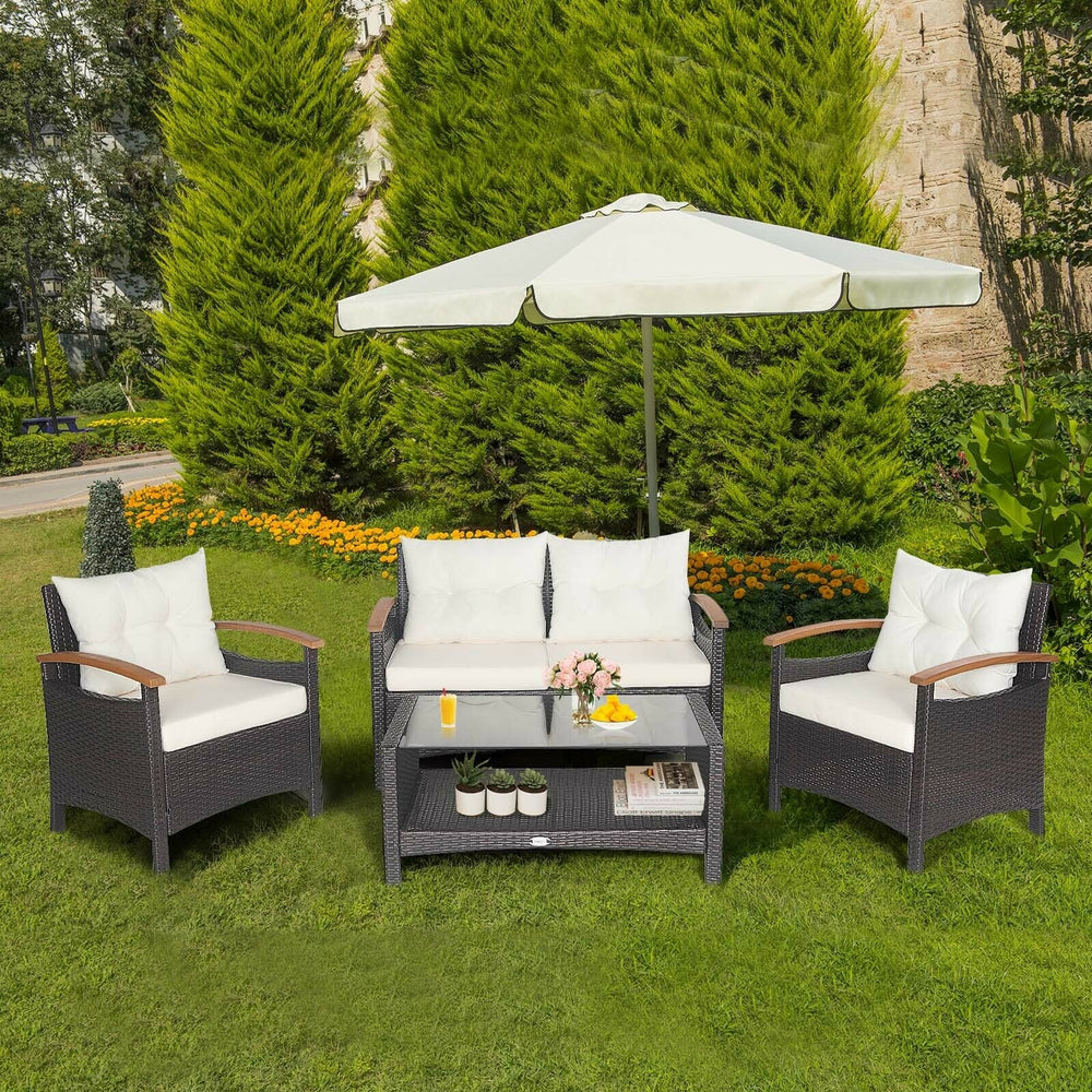 4-piece patio rattan furniture set with cushioned loveseat and chairs, ideal for outdoor relaxation in the backyard.