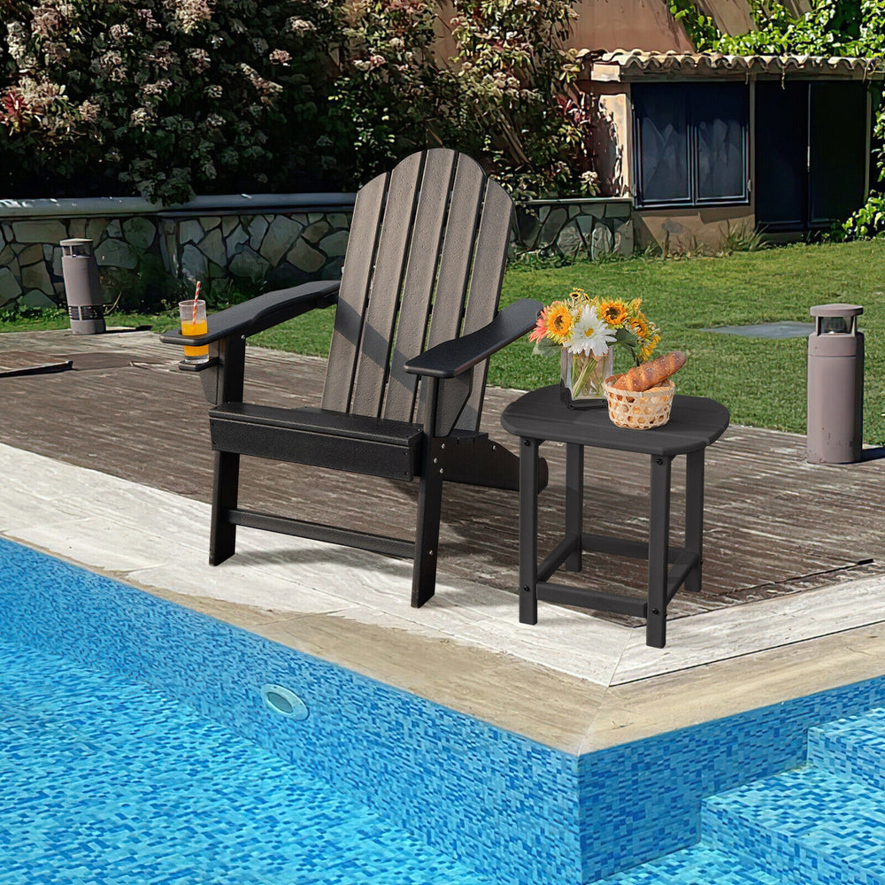 Black outdoor Adirondack chair with built-in cup holder, perfect for poolside relaxation and easy maintenance.