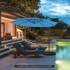10 feet blue patio solar-powered cantilever umbrella with LED lights, tilted for optimal shade by the poolside.
