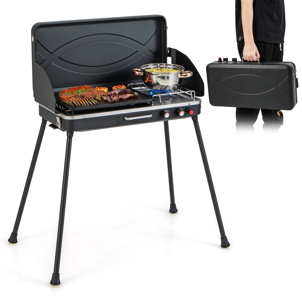 Portable 2-in-1 gas camping grill and stove in black with detachable legs, ideal for BBQs and outdoor cooking.