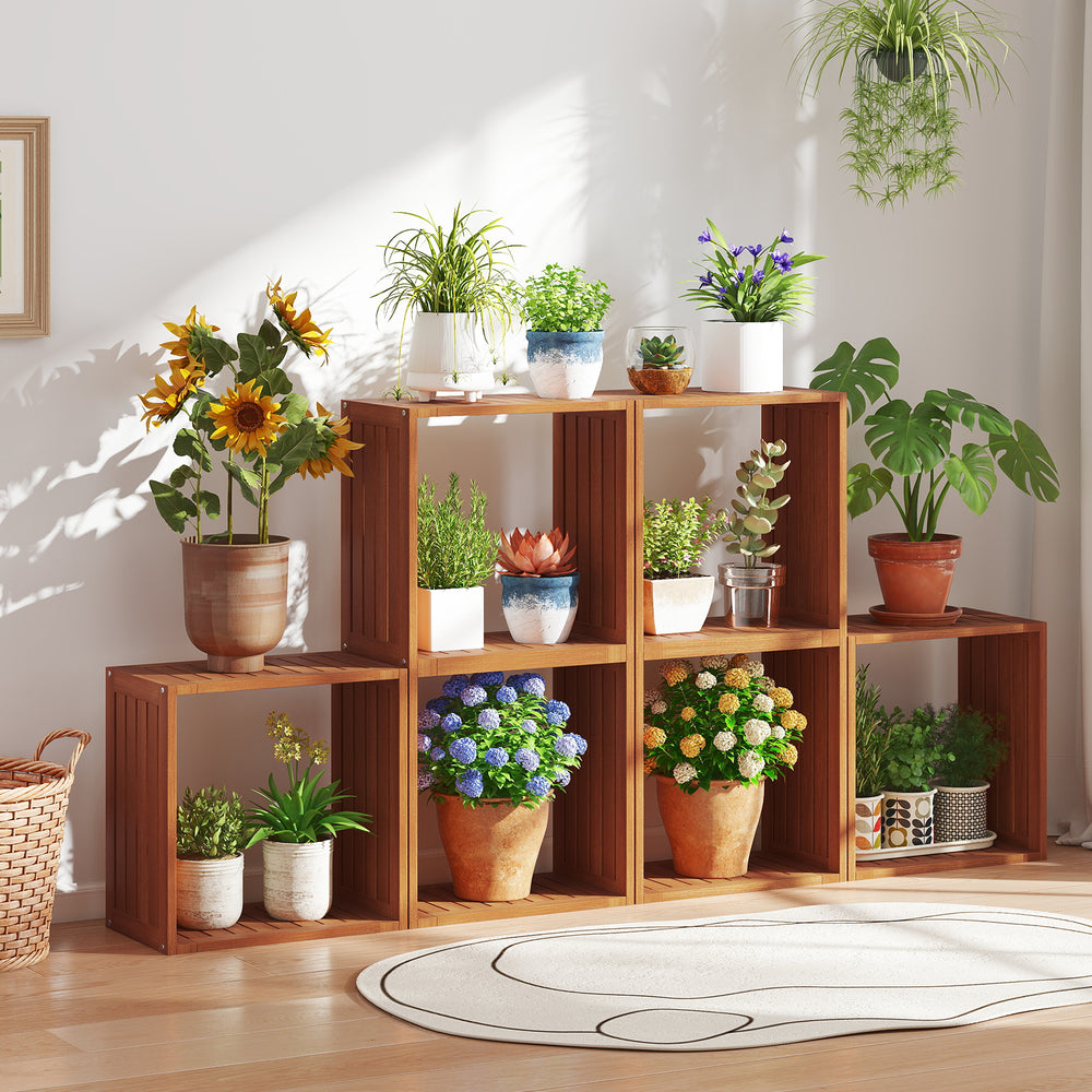 Solid wood stacking storage organizer with open slatted design, showcasing plants and flowers for indoor display.
