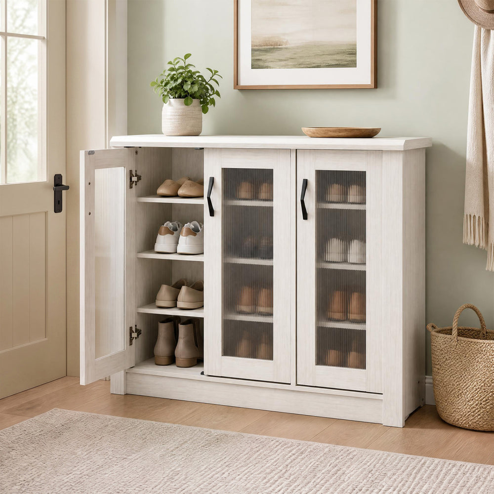 Stylish 3-door shoe cabinet in white featuring fluted transparent doors, perfect for showcasing and organizing footwear.