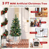 3 FT mini artificial Christmas tree with red berries and frosted pine cones, perfect for tabletop or office holiday.
