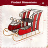 Christmas metal sleigh decoration featuring a vibrant red body, black and gold scrollwork, and a 2-tier storage shelf.