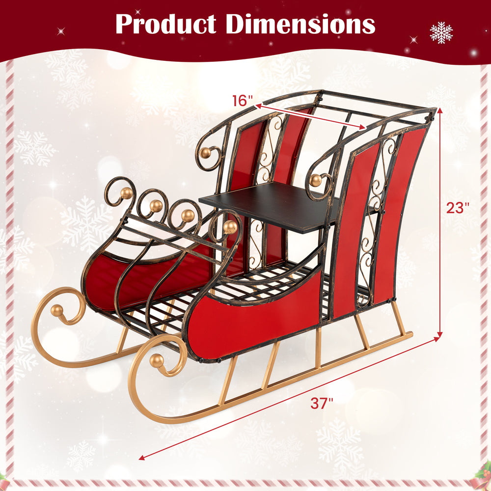 Christmas metal sleigh decoration featuring a vibrant red body, black and gold scrollwork, and a 2-tier storage shelf.