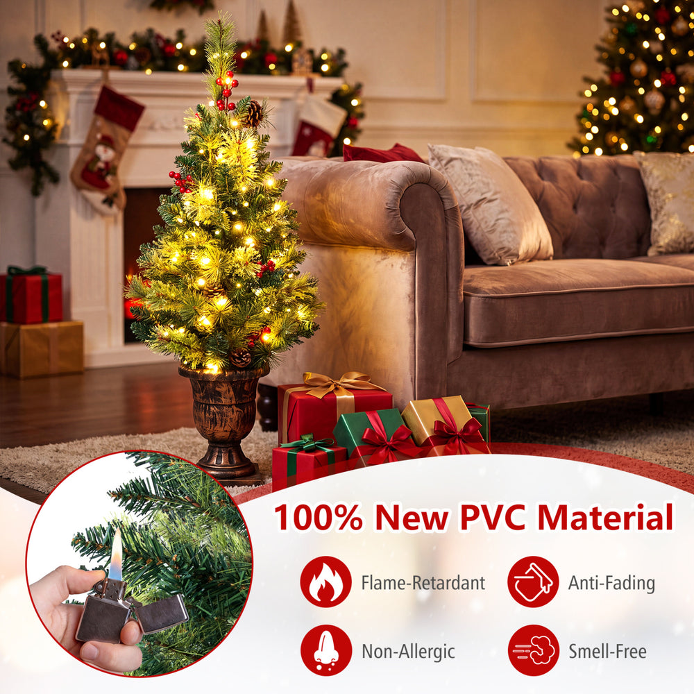 3 FT pre-lit tabletop Christmas tree made of 100% new PVC material with 40 LED lights, pine cones, and red berries.