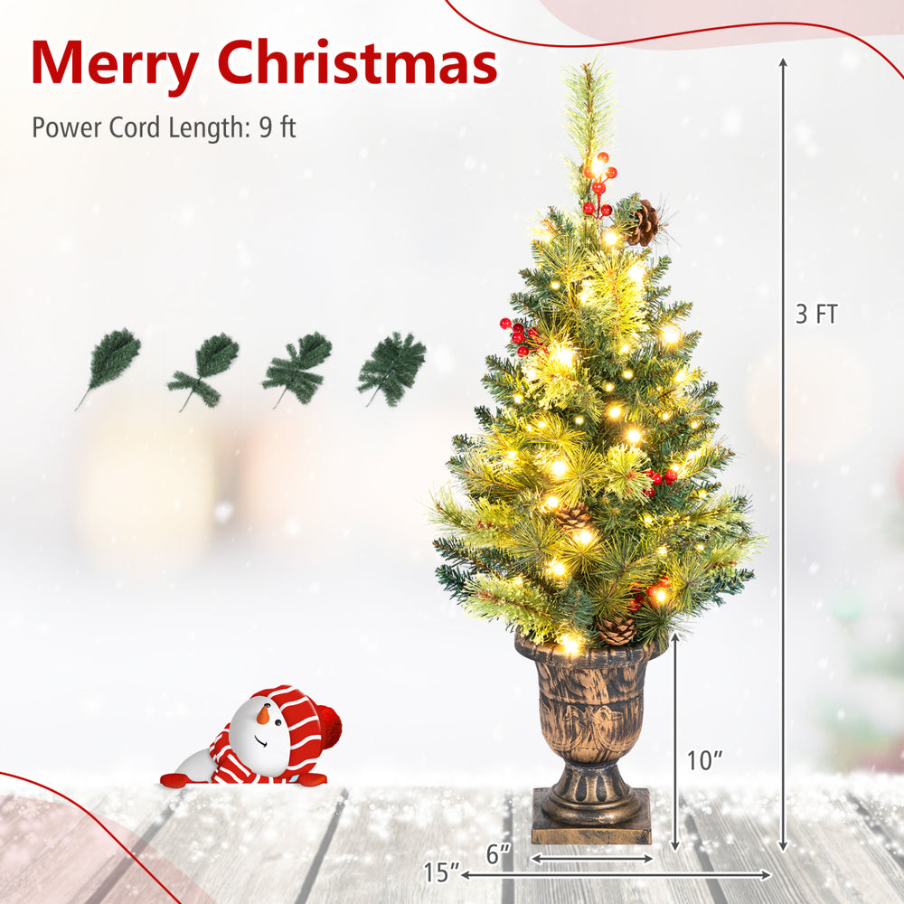 3 FT pre-lit tabletop Christmas tree with 40 LED lights, gold urn base, red berries, and pine cones for festive decor.