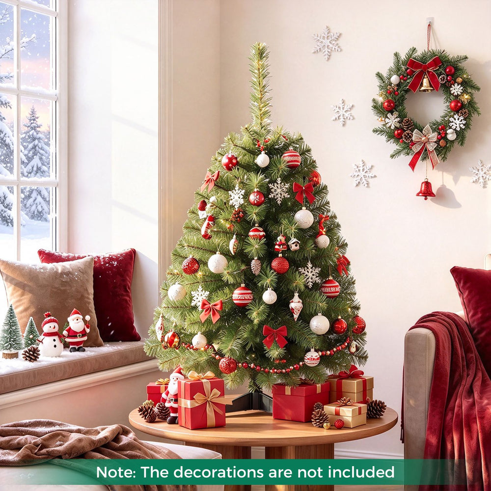 Decorated 3 FT Mini Tabletop Christmas Tree with 113 Green PVC Branch Tips displayed in a festive living room.