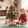 Decorated 3 FT Mini Tabletop Christmas Tree with 113 Green PVC Branch Tips beside holiday gifts indoors.