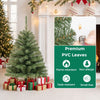 3 FT Mini Tabletop Christmas Tree with 113 Green PVC Branch Tips displayed beside festive gifts in a holiday room.