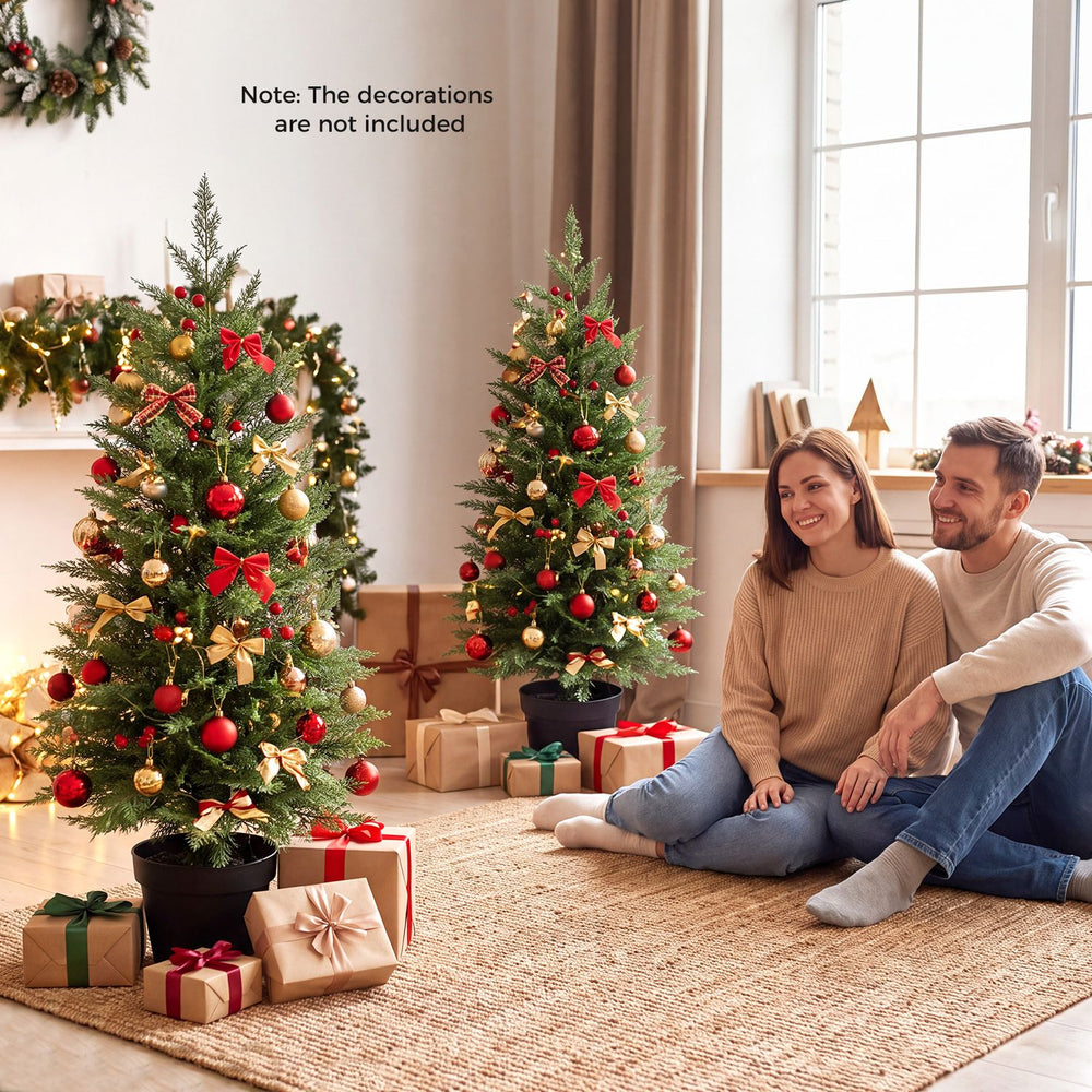 Set of 2 pre-lit 3 FT Christmas trees with PE branch tips, featuring 50 LED lights for festive charm in small spaces.