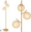 Three-globe floor lamp in gold with acrylic shades, foot switch, and sturdy base for stylish home or cafe lighting.