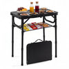 Folding camping table in black with large storage net, showcasing snacks and drinks, ideal for outdoor use.