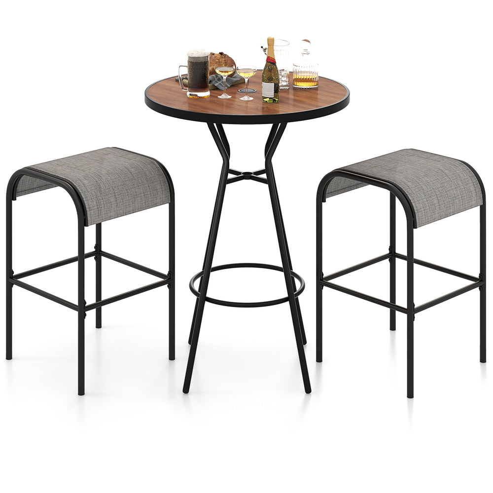Outdoor bar table set featuring a wood-grained tabletop and two breathable fabric stools, ideal for patio relaxation.