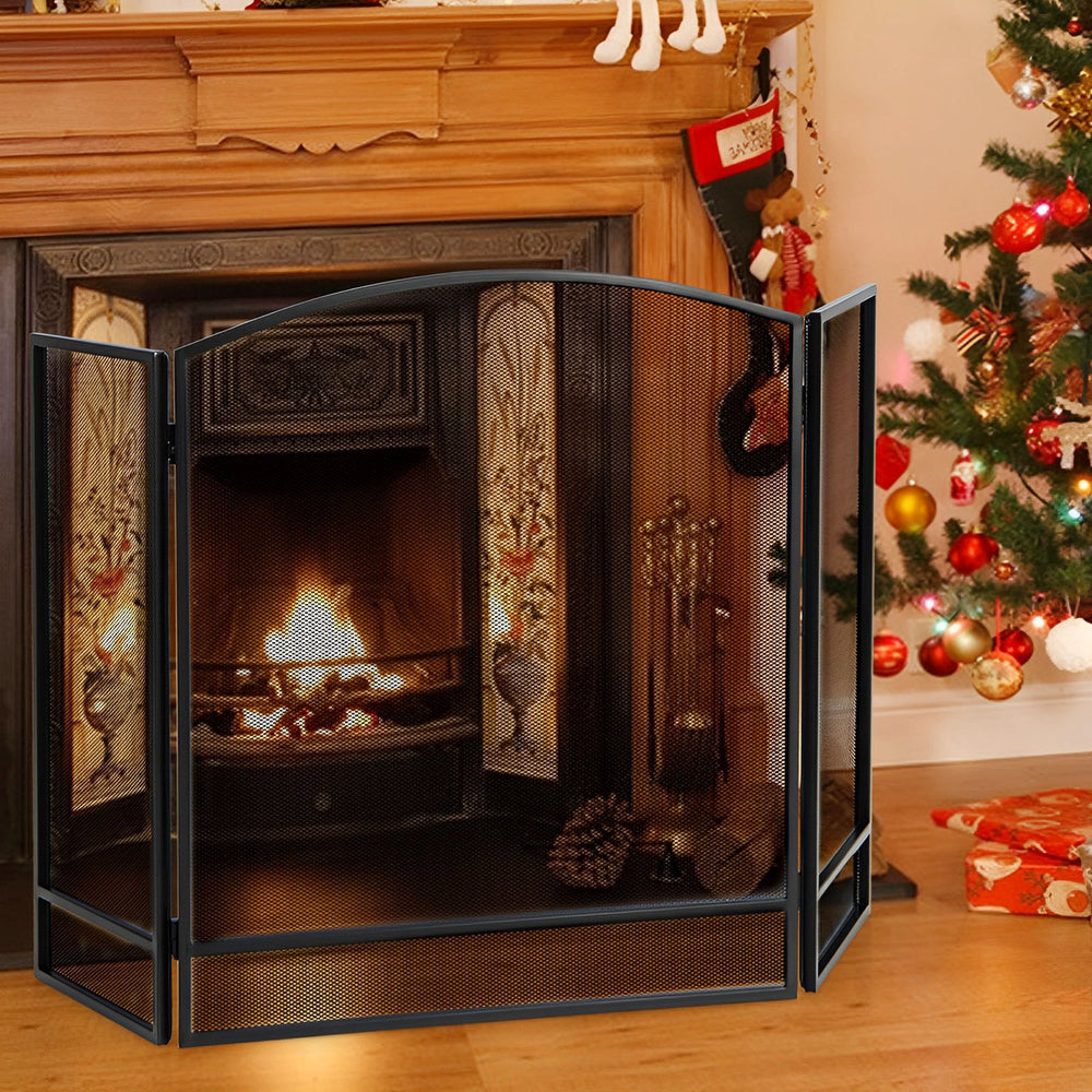 3-panel foldable fireplace screen in black wrought iron, providing safety for kids and pets while enhancing living room.
