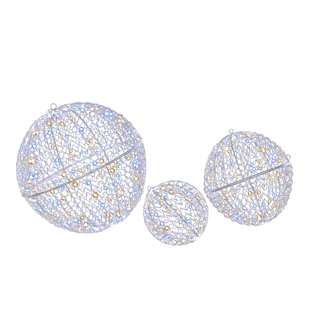 Three lighted metal sphere decorations with 435 LEDs, ideal for hanging or standing in outdoor winter displays.