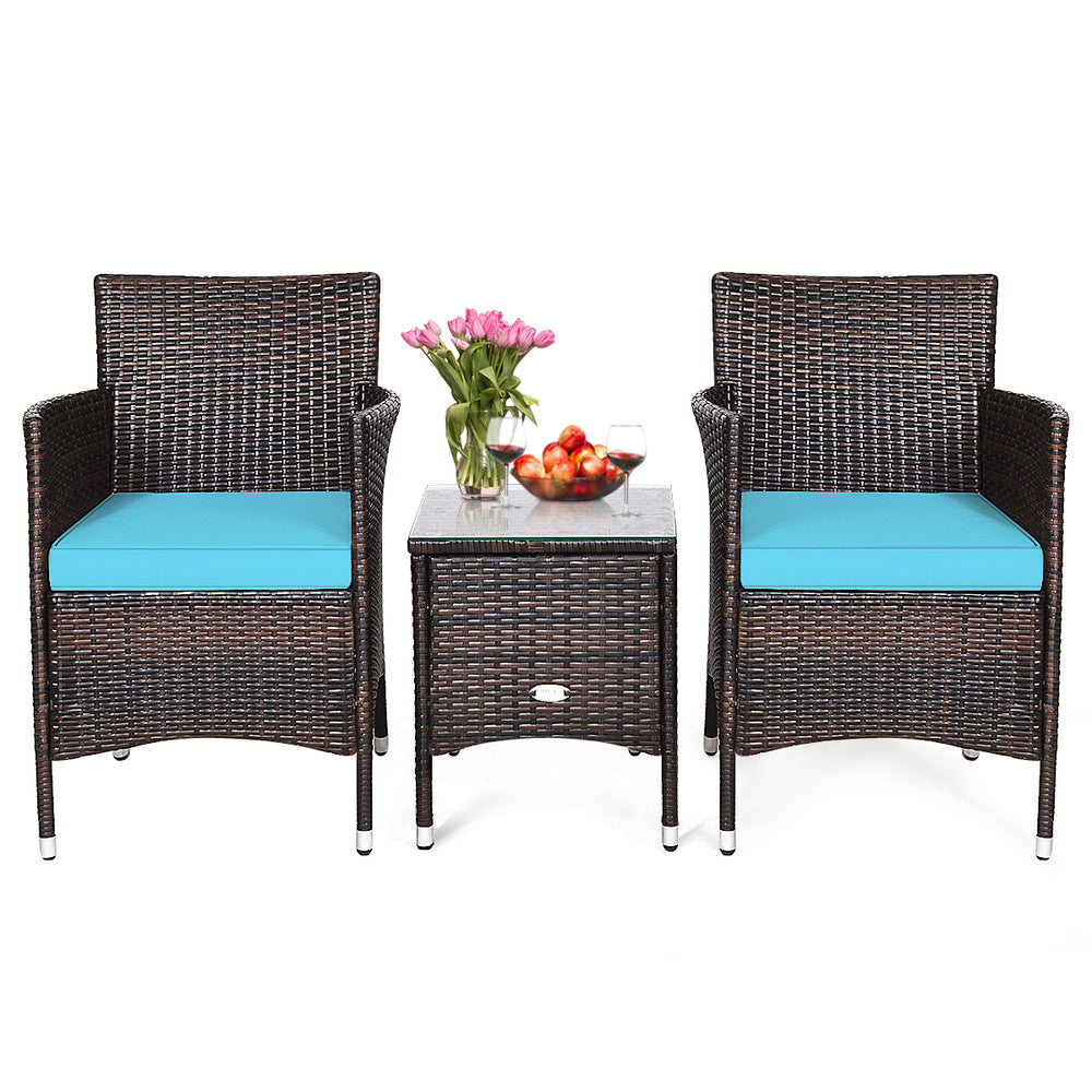 Two blue-cushioned rattan chairs and a tempered glass table in a 3-piece outdoor furniture set for patio relaxation.