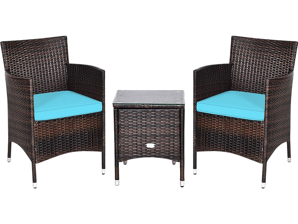 Two rattan chairs with blue cushions and a glass-top table, perfect for outdoor patio relaxation and entertaining.