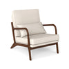 Modern accent chair with ergonomic armrests and lumbar pillow, featuring a beige cushion and dark wood frame for.