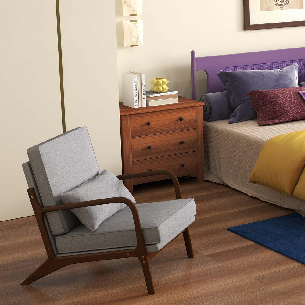 Modern accent chair with grey cushion and wooden frame, perfect for bedroom relaxation and comfort.