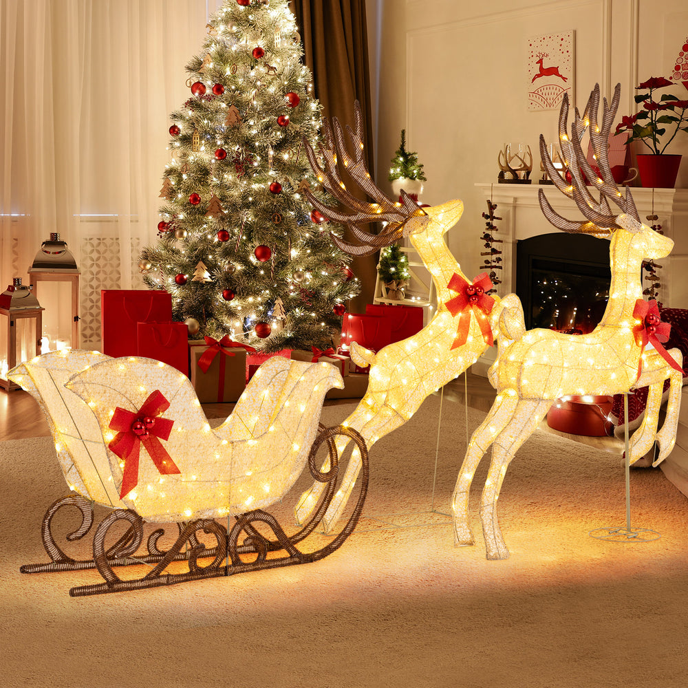 Lighted 3-piece Christmas reindeer and sleigh set with 280 warm white LEDs, perfect for outdoor holiday decoration.