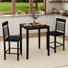 Counter-height dining table set with black rubber wood frame, featuring two chairs and footrests, ideal for small.