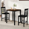 Black counter-height dining chairs with curved backrests and footrests, designed for comfort in small dining areas.