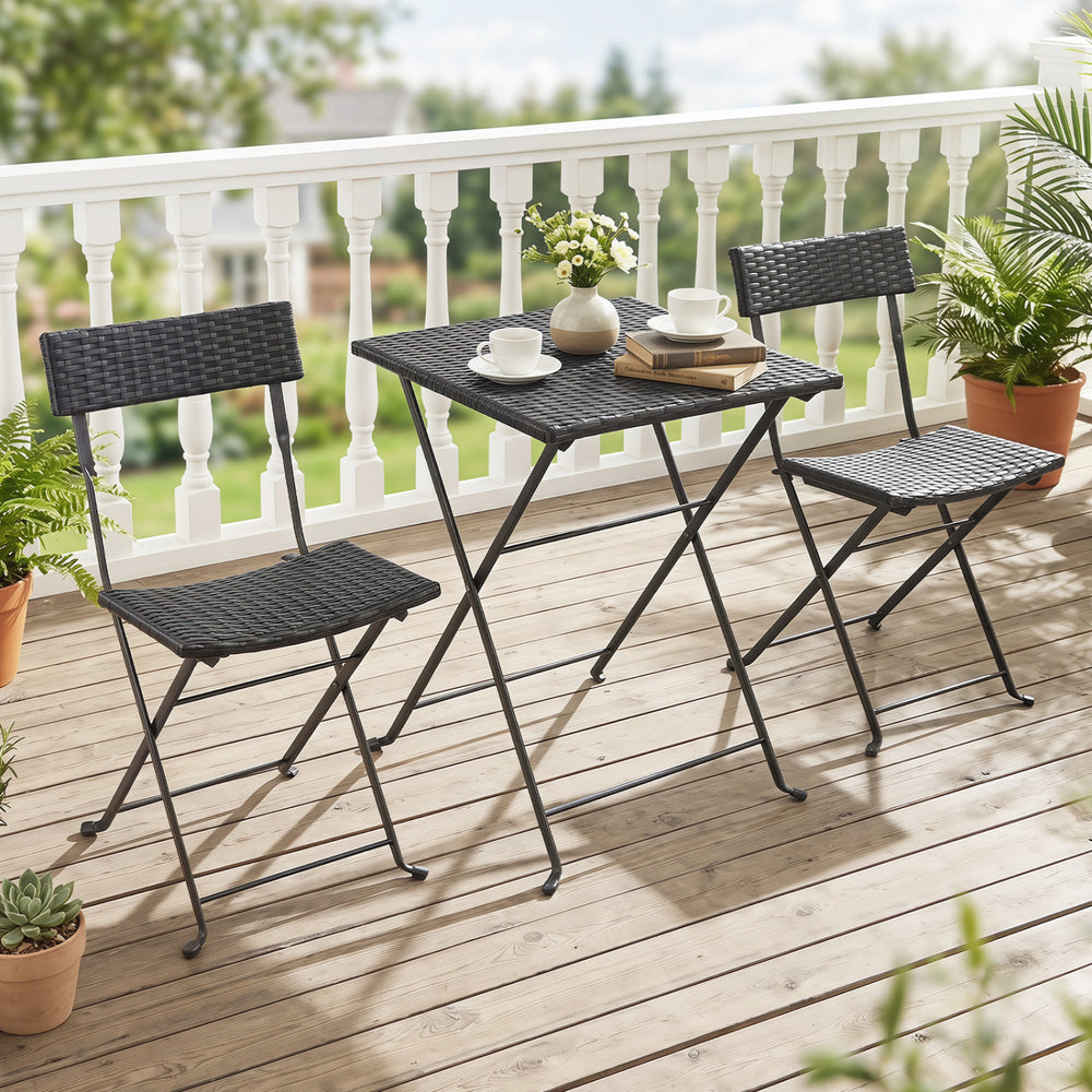 Folding bistro set featuring a black PE wicker table and chairs, perfect for outdoor patios and compact spaces.