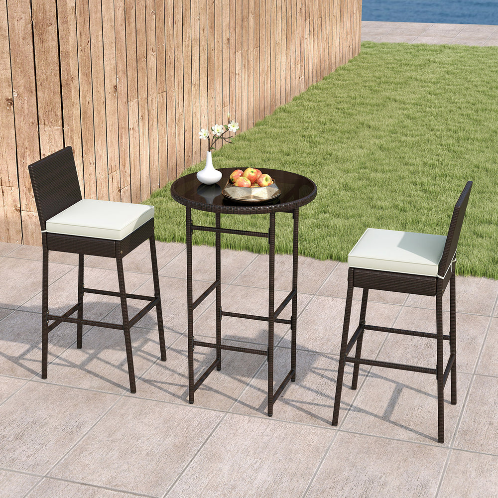 Outdoor bar set featuring two barstools and a round table with a tempered glass top, ideal for backyard relaxation.
