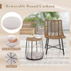 Removable round cushion on a rattan chair with a side table, perfect for outdoor patio relaxation and pet comfort.