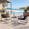 3-piece outdoor rocking bistro set featuring soft cushions and a tempered glass table, ideal for patio relaxation.