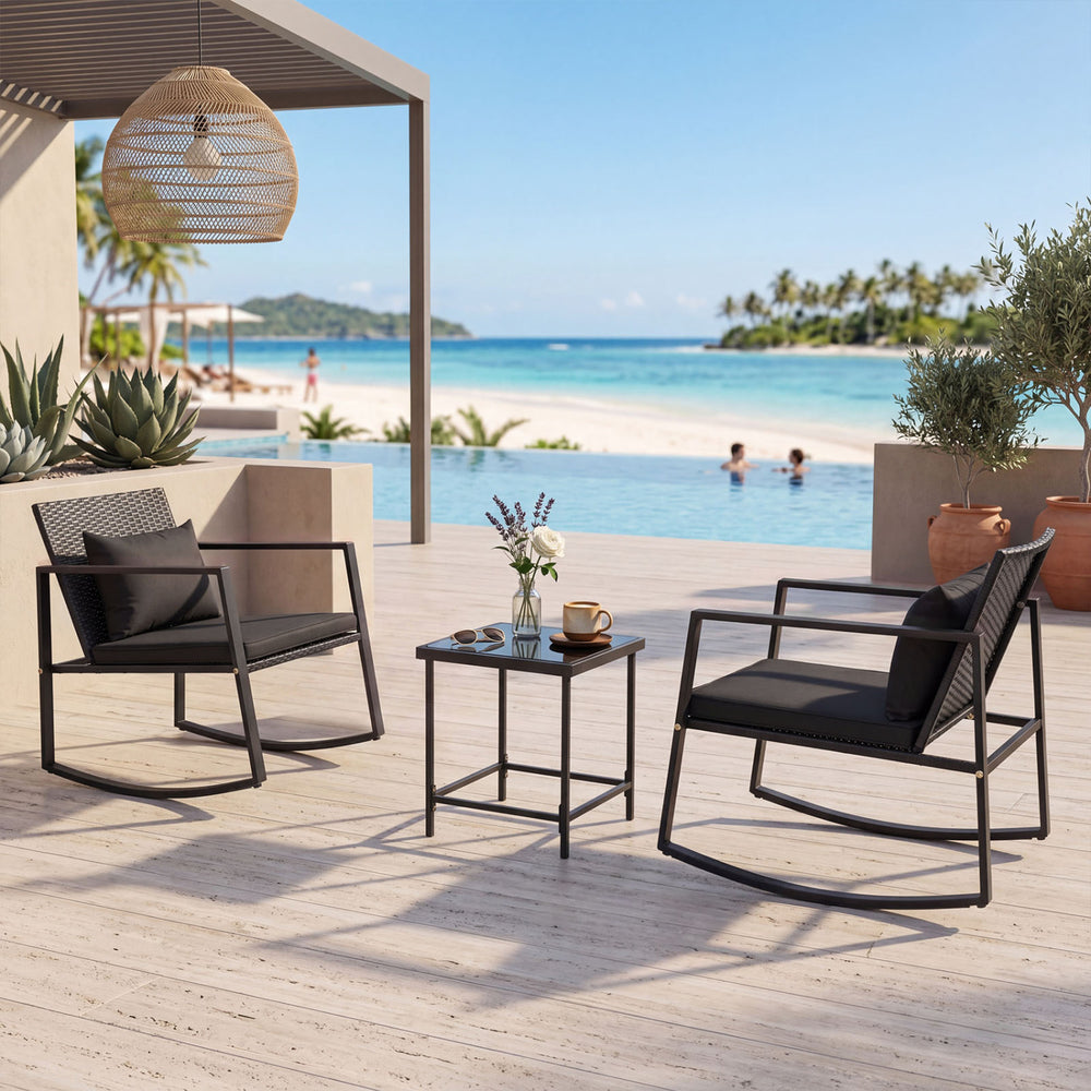 3-piece outdoor rocking bistro set featuring soft cushions and a tempered glass table, ideal for patio relaxation.