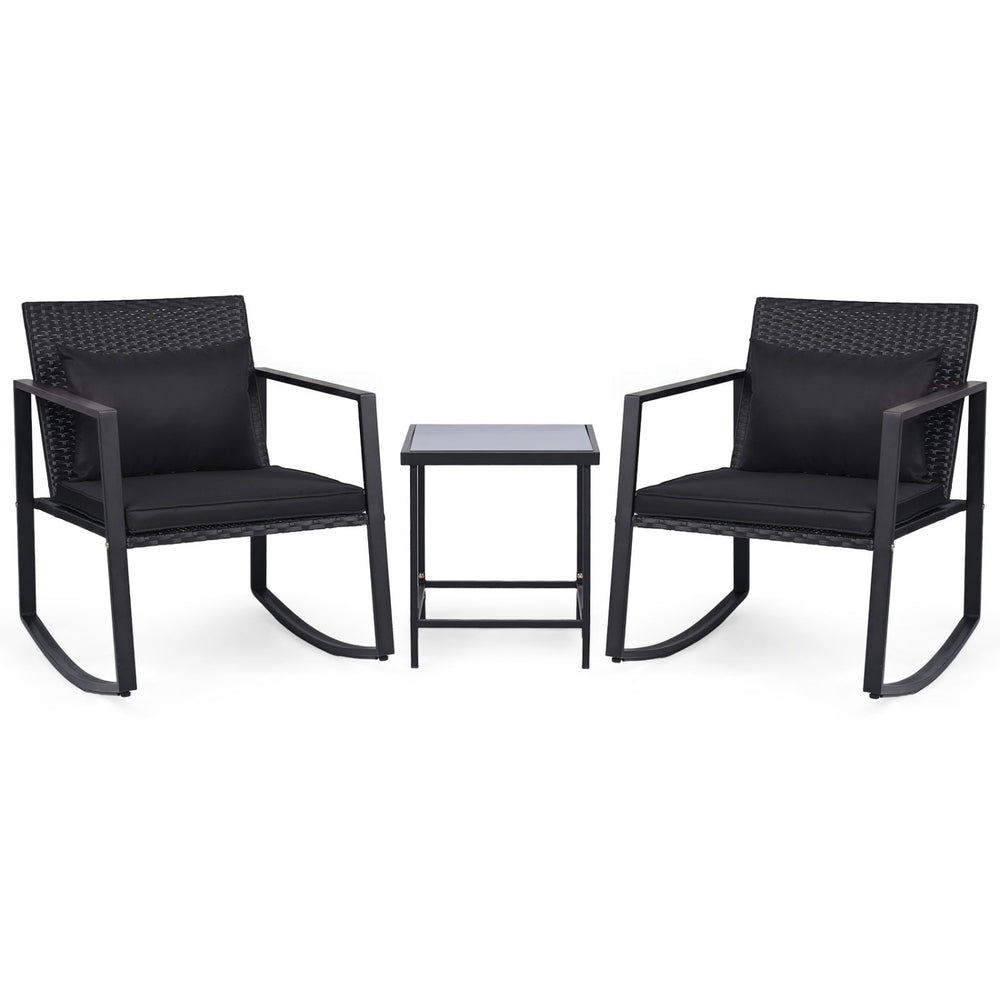 3-piece outdoor rocking bistro set with black cushions and tempered glass table, perfect for patio relaxation.