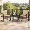 Two brown rocking chairs with thick cushions and a glass-top table create a cozy outdoor conversation space.