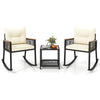 Two rocking chairs with cream cushions and a black coffee table, made of PE rattan, perfect for outdoor relaxation.