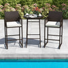 Bar height table and two armchairs in dark wicker with white cushions, perfect for poolside relaxation.